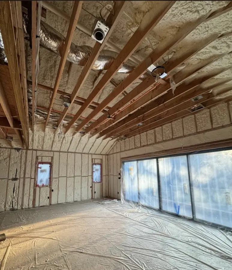 Interior walls and ceiling insulated with spray foam during new construction in Davenport